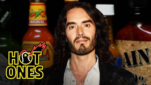 Hot Ones - S14E11: Russell Brand Serenades Superfan Brett Baker While Eating Spicy Wings